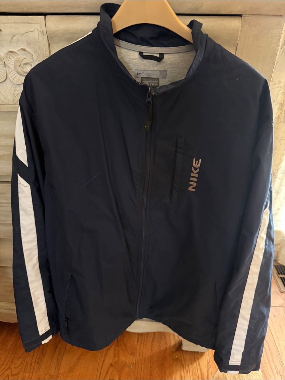 Nike Men's Navy Windbreaker with White Sleeve Stripes